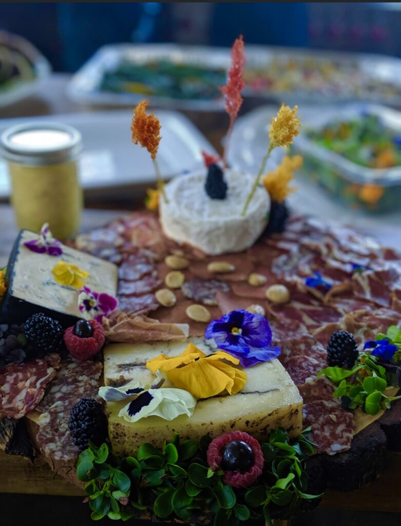 charcuterie board with edible flowers